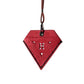 Red triangular leather charm with embossed pattern and black H emblem, hanging on cord