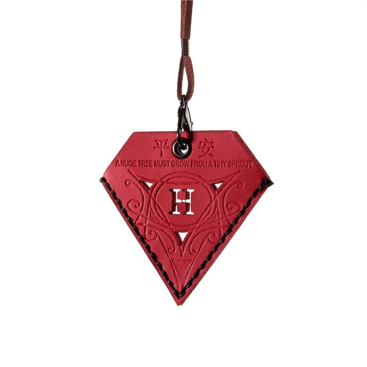 Red triangular leather charm with embossed pattern and black H emblem, hanging on cord