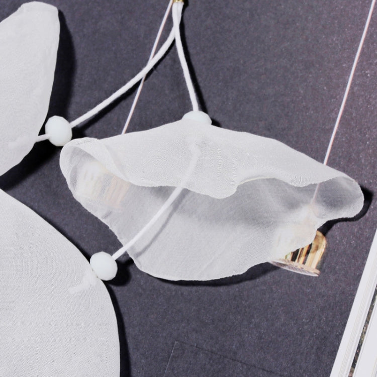White sheer fabric petal earrings with hanging tassel cords and gold-tone hooks