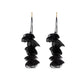 Long fabric petal earrings in black with four layered petals and gold hooks