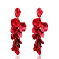 Red fabric petal earrings with layered dangling petals and gold hook