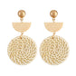 Bamboo vine woven earrings with tan half-moon cap and round cream woven dangle