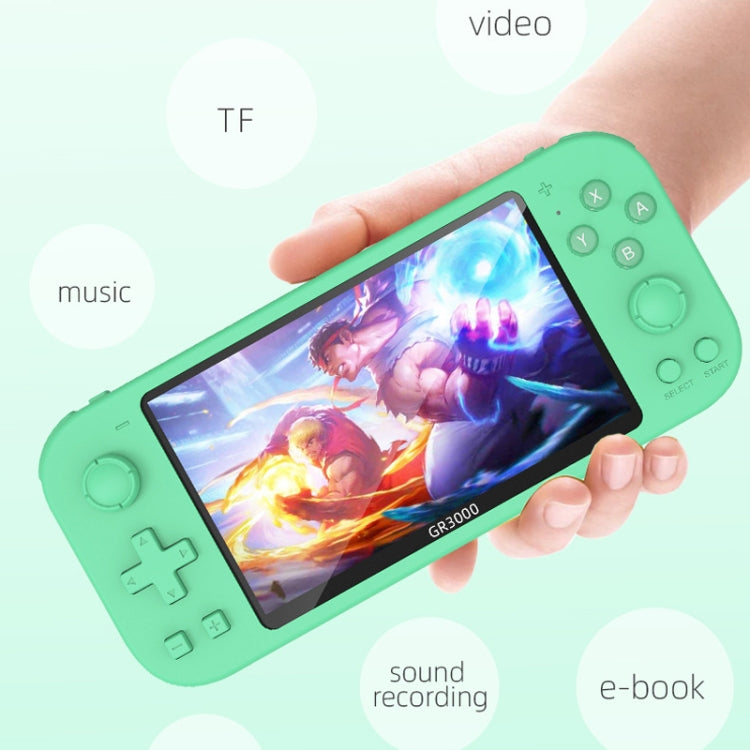 Green handheld game console held in hand with touchscreen game display