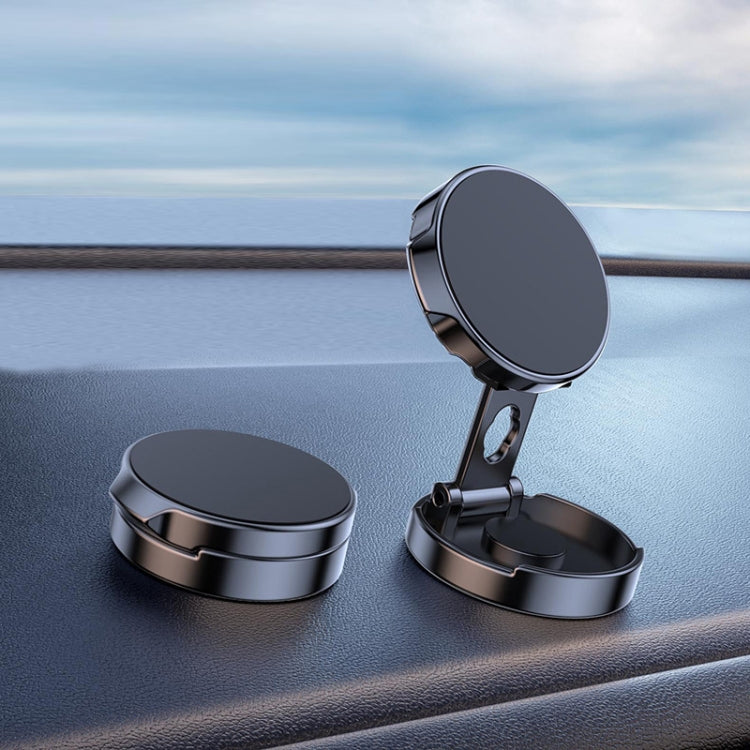 Black circular car magnetic suction phone bracket with hinged stand on dashboard