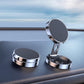 Silver circular car magnetic suction phone bracket with open base on dashboard