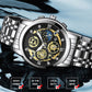 Silver-tone wristwatch with black skeleton dial, gold accents, and metal bracelet