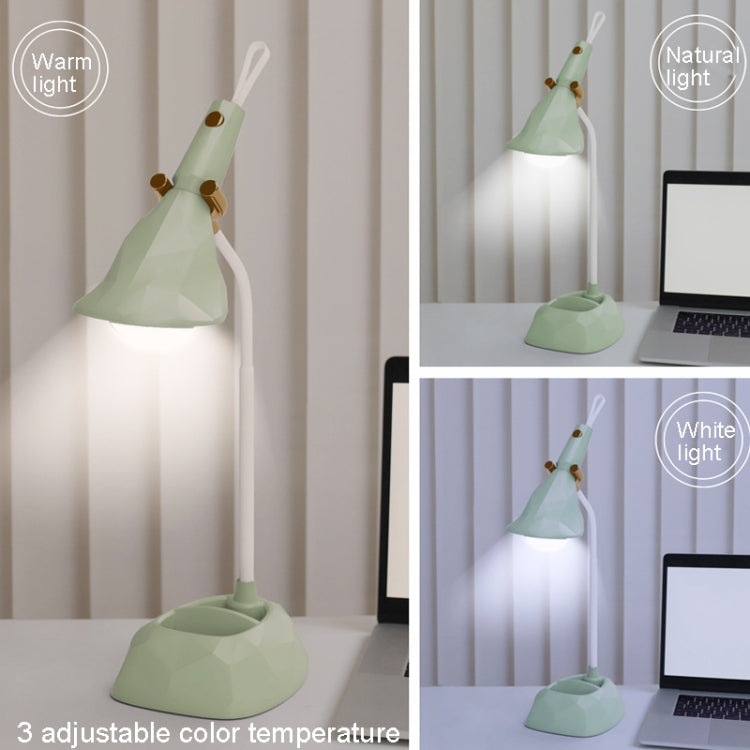 Green diamond desk lamp lighting at different brightness settings on a desk