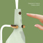White desk lamp with faceted body, gold buttons, fingertip touch control