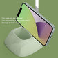 White removable desk lamp base holding a smartphone and cable