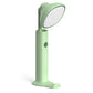 Folding flashlight desk lamp in green with wide oval light head and stable base stand