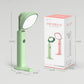 Green folding flashlight desk lamp next to product box with visible dimensions