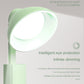 Green folding flashlight desk lamp with glowing oval head, USB charging design