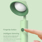 Green folding desk lamp with fingertip button on the stem and round head