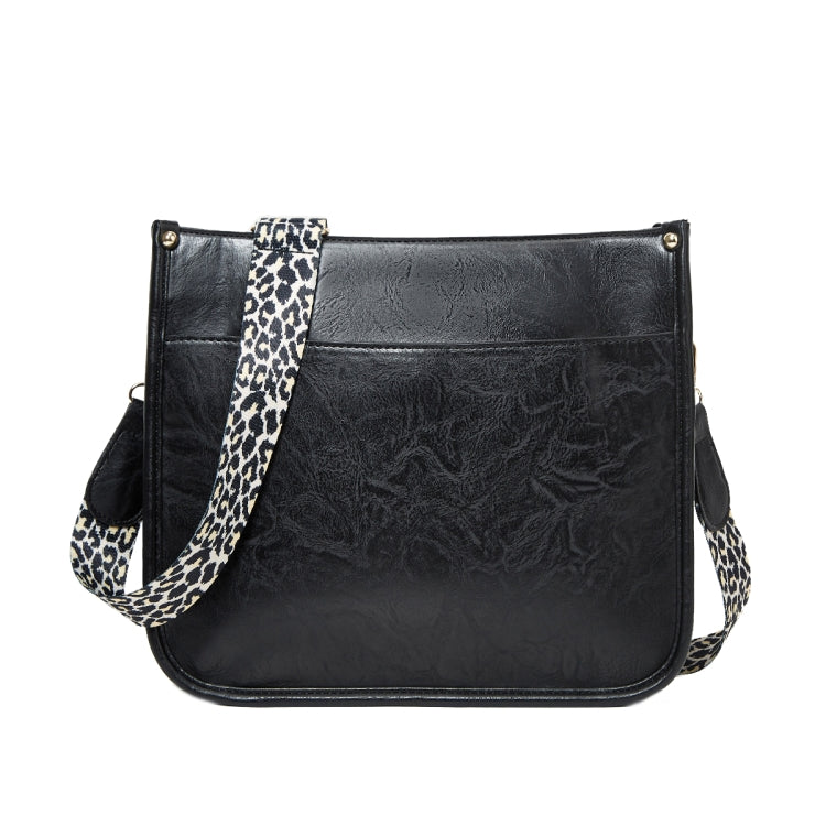 Black PU leather crossbody tote bag with leopard-print strap and front flap pocket