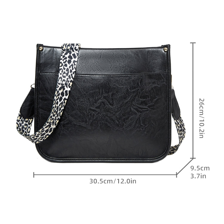 Black PU leather crossbody tote bag with leopard-print strap, front flap and gold hardware