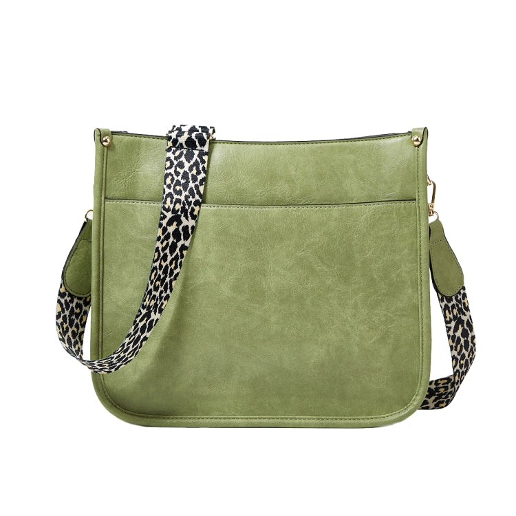 Green PU leather crossbody tote bag with leopard-print strap and front pocket seams