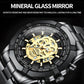 Close-up skull skeleton quartz watch with gold dial skeleton and tachymeter bezel