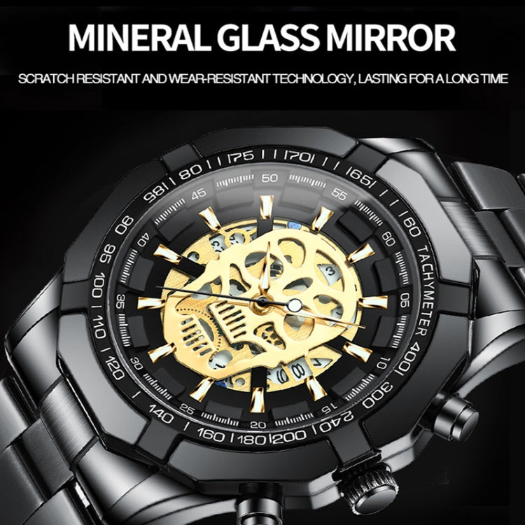 Close-up skull skeleton quartz watch with gold dial skeleton and tachymeter bezel
