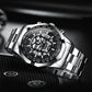 Silver-tone quartz skull watch with black dial skeleton and luminous blue accents