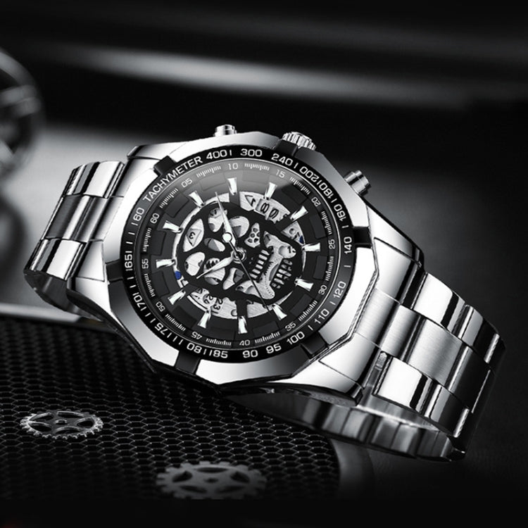 Silver-tone quartz skull watch with black dial skeleton and luminous blue accents