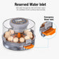 Egg incubator with front water inlet cover and orange reservoir flap on the base