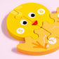 Yellow wooden animal jigsaw puzzle piece with face features and numbers