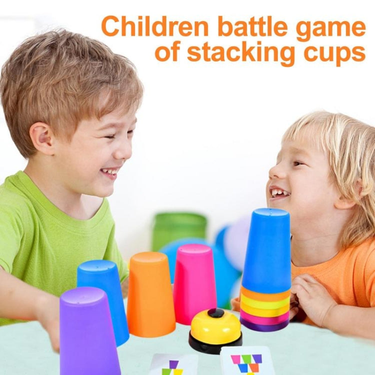 Children playing with multicolor stacking cups on a table