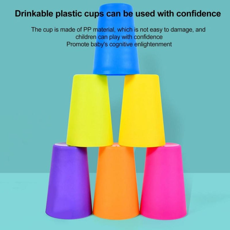 Stack of multicolor plastic stacking cups in blue, yellow, orange, and pink