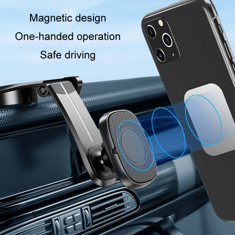 Black magnetic phone holder attached to car air vent with textured magnetic pad