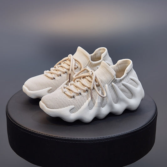 Beige knit sock shoes with mesh upper, lace-up front, and cushioned sole view