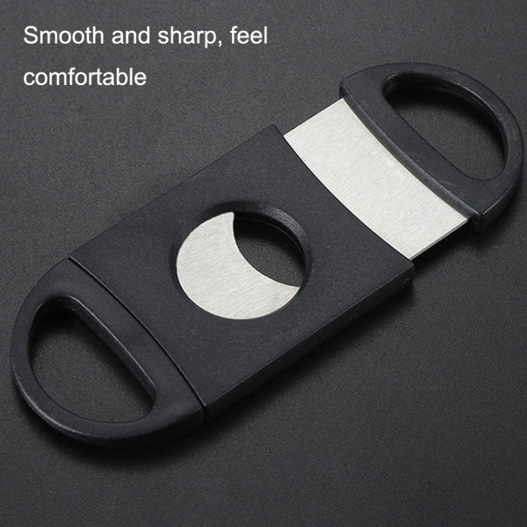 Black cigar crusher with silver blade insert and rounded loop handle