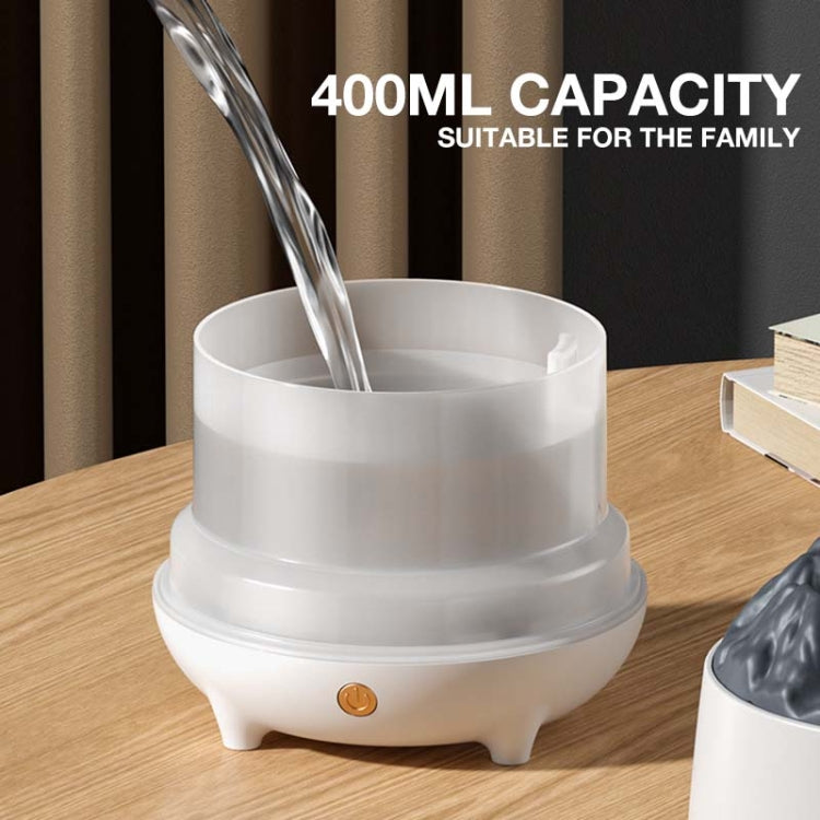 White simulation flame humidifier with open misting chamber and warm light base
