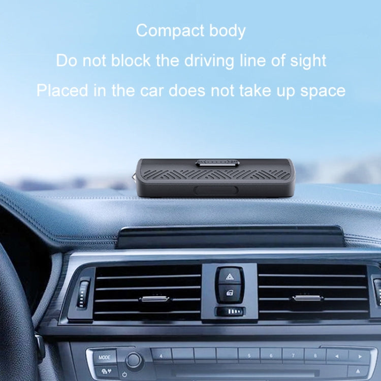 Compact black safety hammer number plate on car dashboard