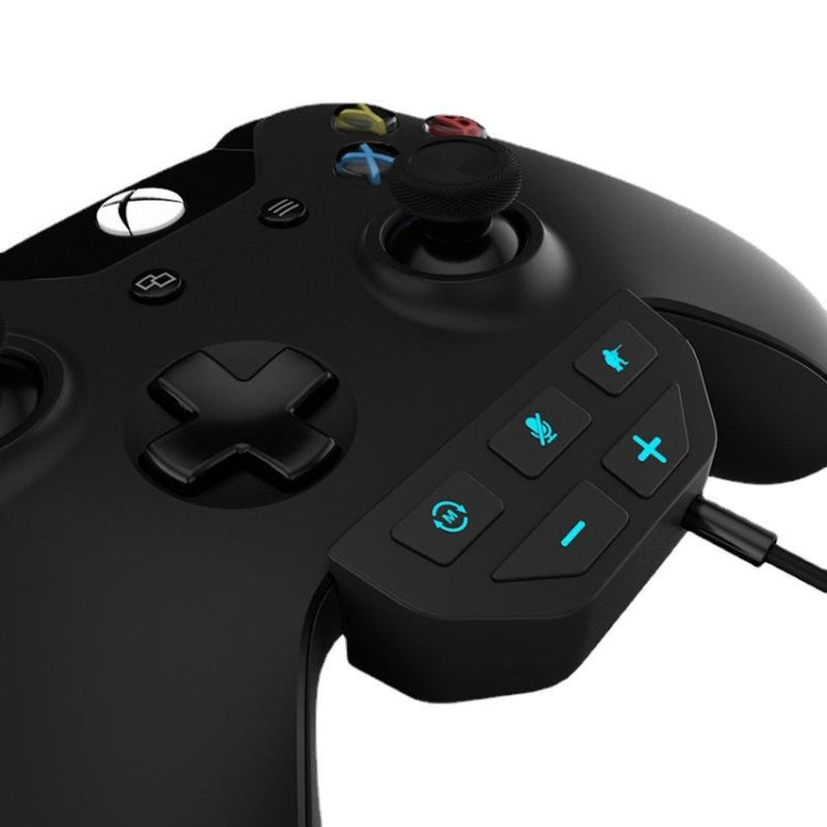 Black gamepad sound enhancer module with button panel on a controller