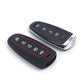 Two silicone key fob cases for 5-button remotes: black with red trim, and black key cover