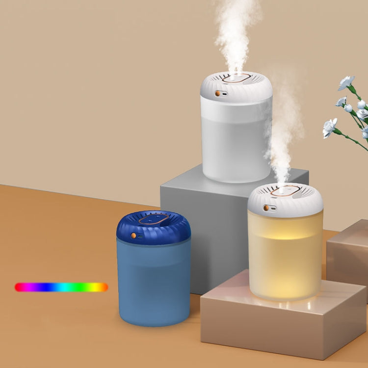 White humidifier on pedestal releasing steam, showing colorful ambient light