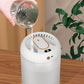 White humidifier with top opening being filled from a glass cup