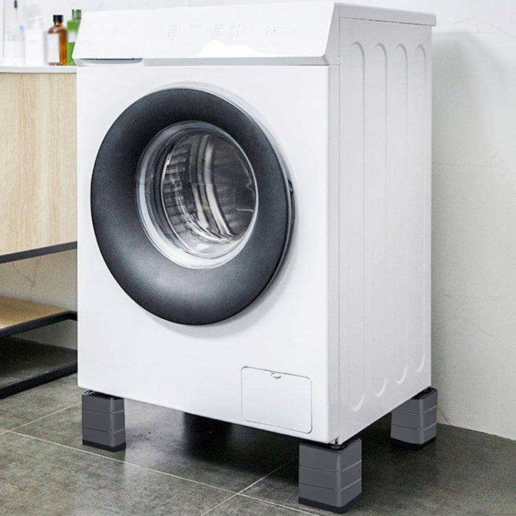 Front-loading washing machine on four dark grey shock-absorbing floor pads