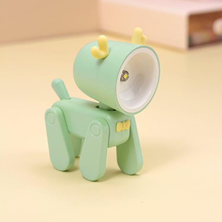 Light mint green cartoon mini table night light with pale yellow head accent and rotating head.