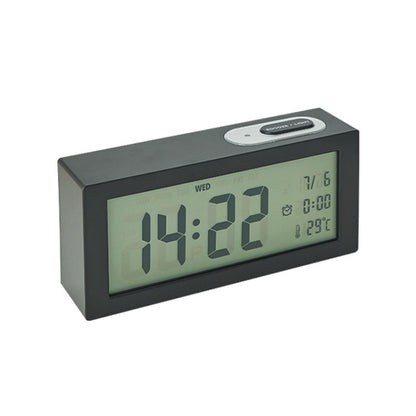 Black bedside digital alarm clock with green LCD time and date display