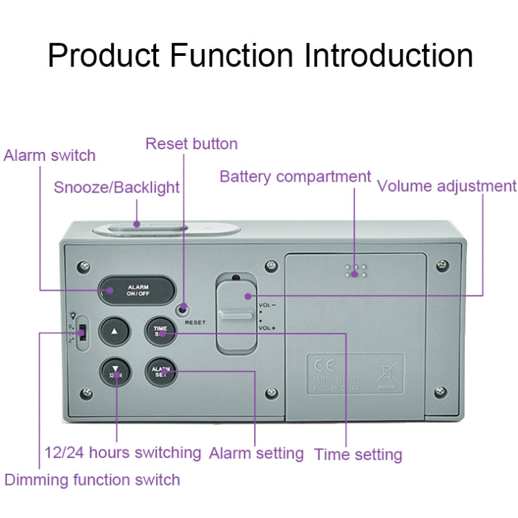 Digital alarm clock underside showing buttons, battery compartment, and volume controls
