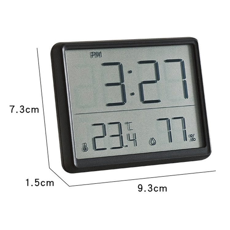 Black thin LCD digital clock with dimensions shown on the front