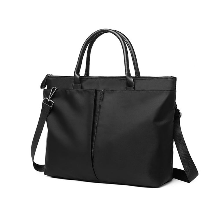 Black laptop tote bag with top handles, shoulder strap, and front buckle detail