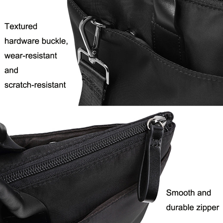 Black tote close-up: textured hardware buckle and smooth durable zipper