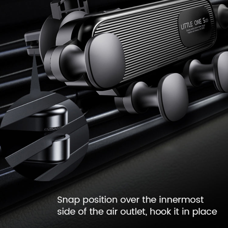 Black air-vent phone holder close-up with snap-fit clamp and rounded grip pads