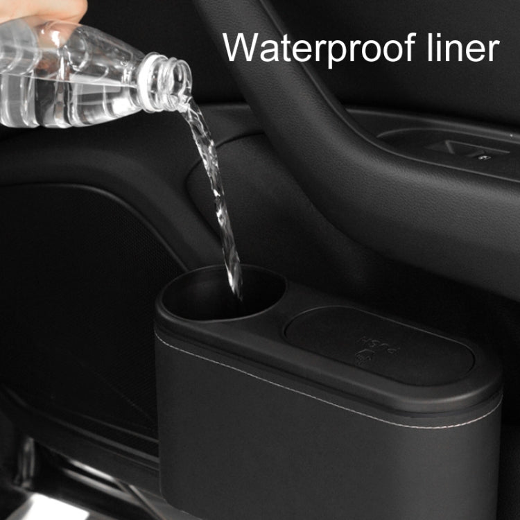 Car seat cup holder trash bin, black plastic with cup opening while water pours in