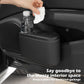 Car seat cup holder trash bin, black plastic with cup opening and bottle being cleaned