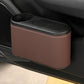Car seat cup holder trash bin, brown plastic body with oval lid and cup opening