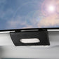 Black car visor tissue holder with oval tissue opening on dashboard edge