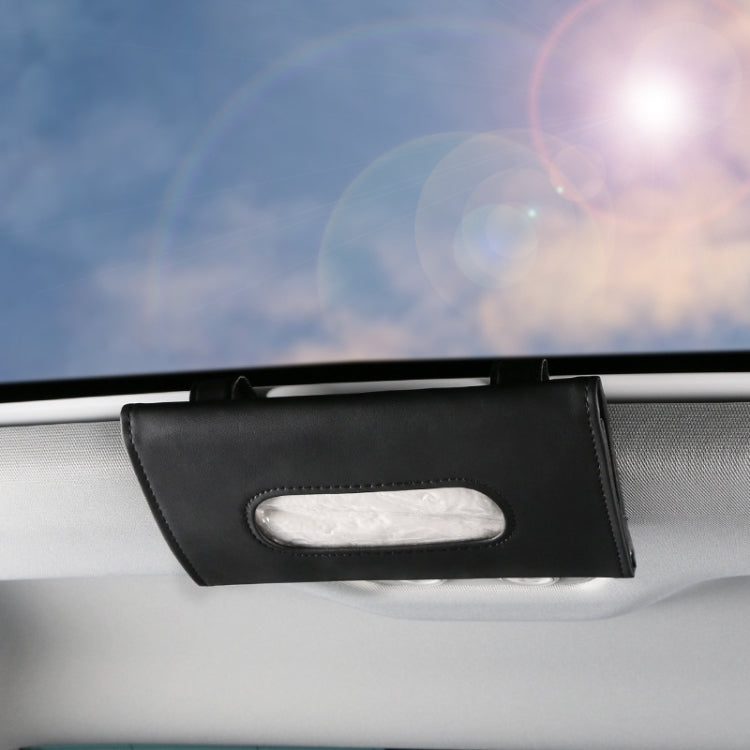 Black car visor tissue holder with oval tissue opening on dashboard edge